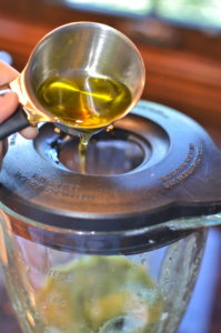 chimichurri sauce- pouring oil