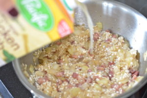 pancetta risotto- pouring in chicken stock