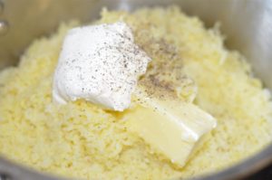 parmesan-mashed-potatoes-adding-butter-and-cream-cheese