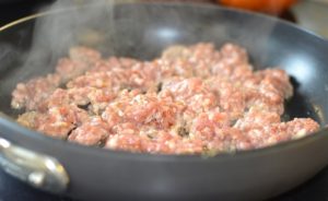 sausage-stuffed-mushrooms-cooking-sausage